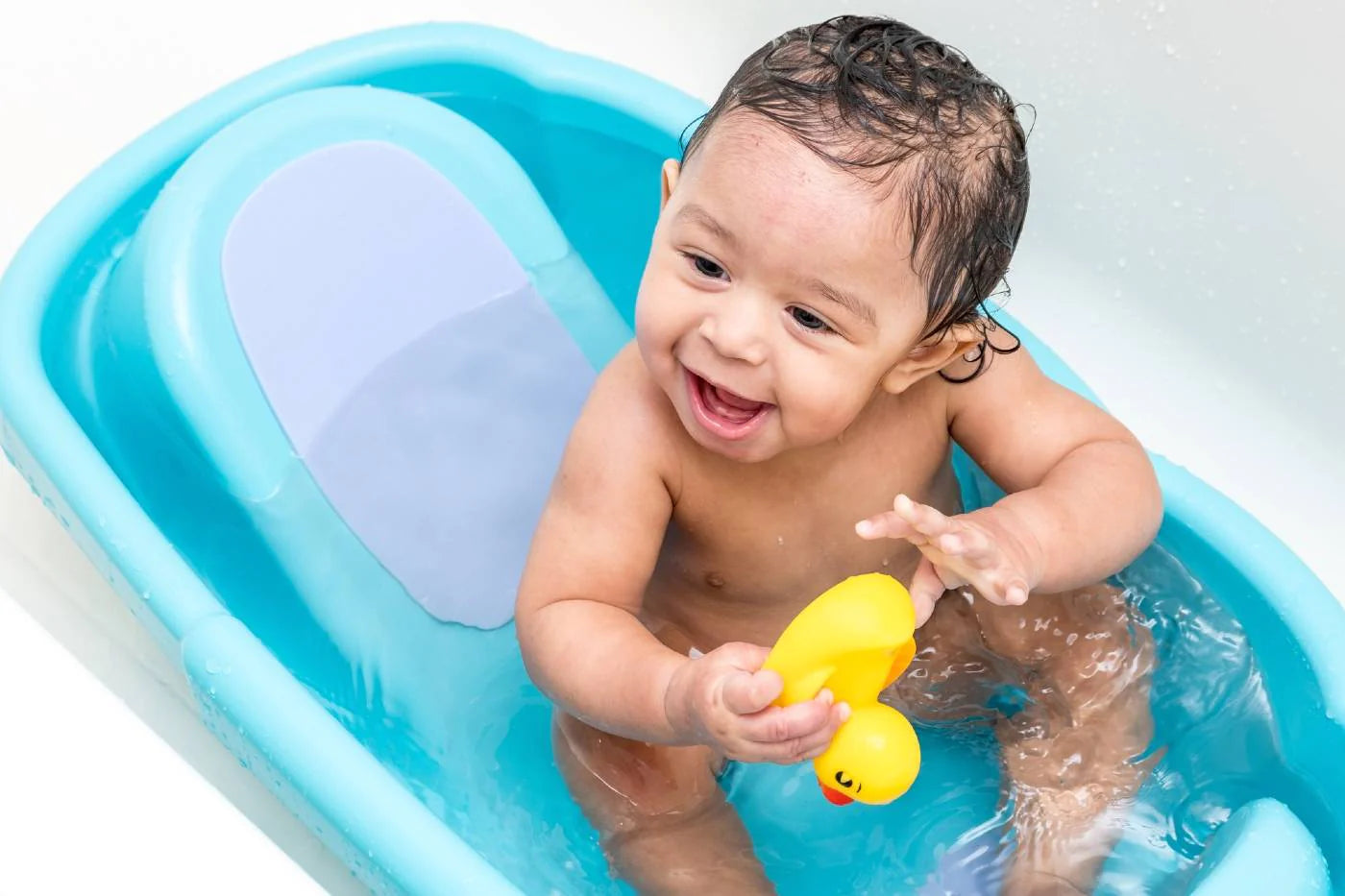 a baby in a bath tub