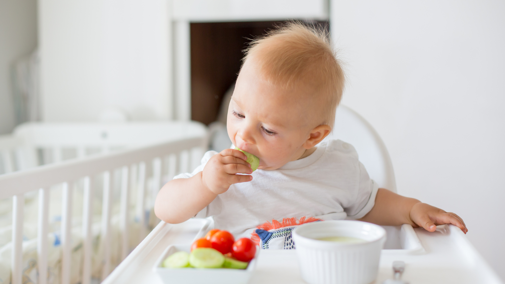 A joyful baby enjoying organic baby food